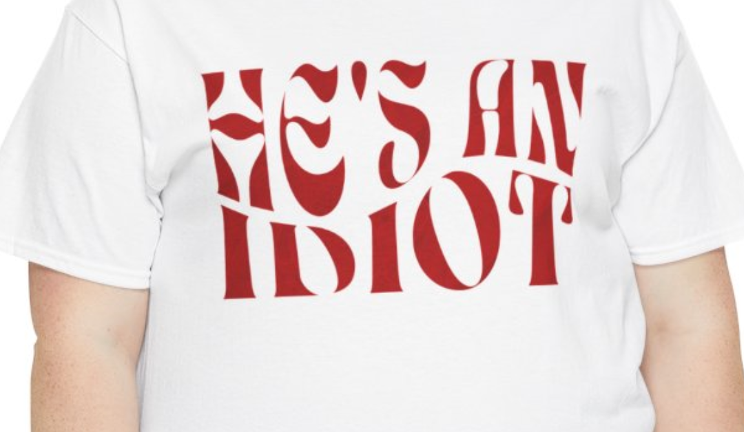 He’s An Idiot T-Shirt – Red Wave Text Design
